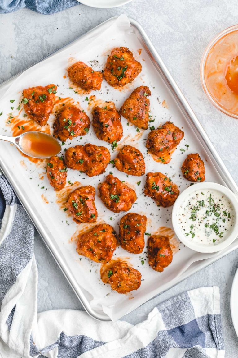 Healthier Baked Buffalo Chicken Nuggets for 418 calories or 6 WW points! This easy recipe is lighter comfort food, with crispy breading, spicy sauce, and cool, creamy blue cheese dressing